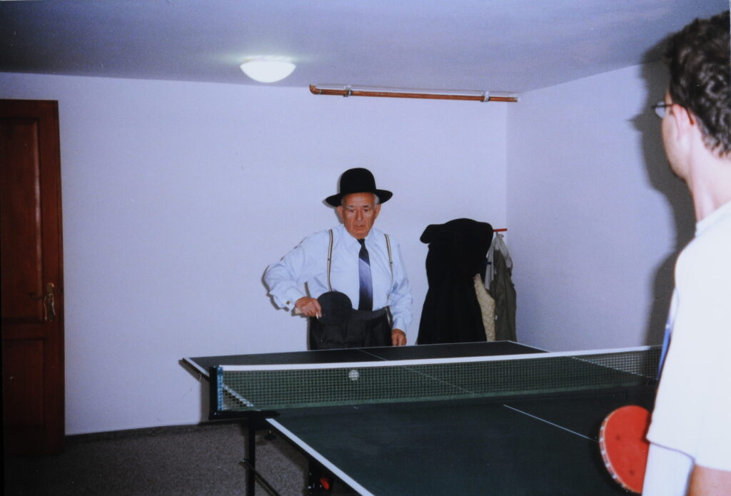 15 Anti playing ping pong in his 90 ies with his grandson