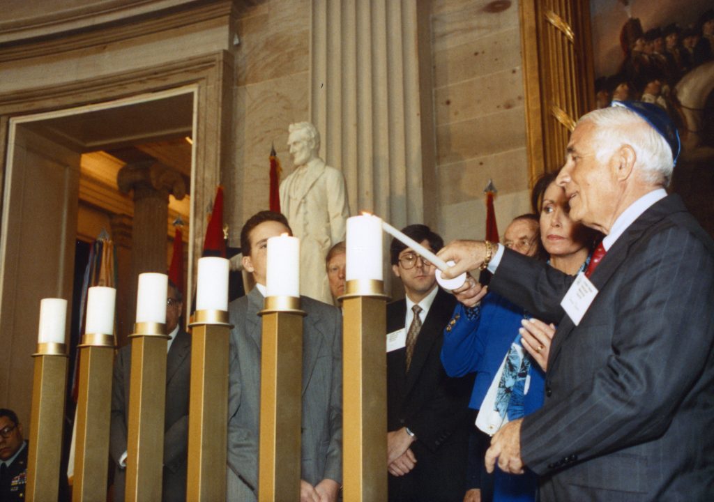 Lighting the one of the six candles in the rotunda in Washing DC the day of the ground breaking of the National Holocaust Museum (1)